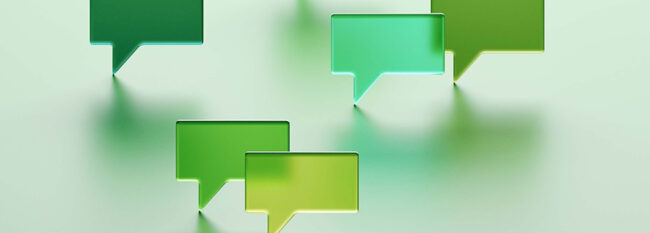 Translucent word bubbles in various shades of green against a lighter green background