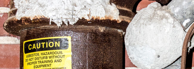 Asbestos-containing thermal system insulation (TSI) labelled following an asbestos containing materials (ACM) inspection by an inspector