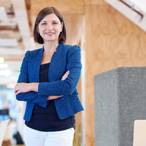 Portrait of a businesswoman standing with her arms crossed confidently and smiling at the camera