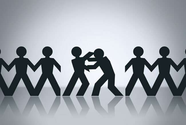 Illustration shows paper cutouts of people in a line, middle two are fighting