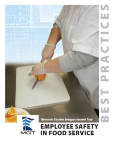 Cover of Employee Safety in Food service best practices. Photo features a woman cutting an orange on a cutting board wearing gloves.