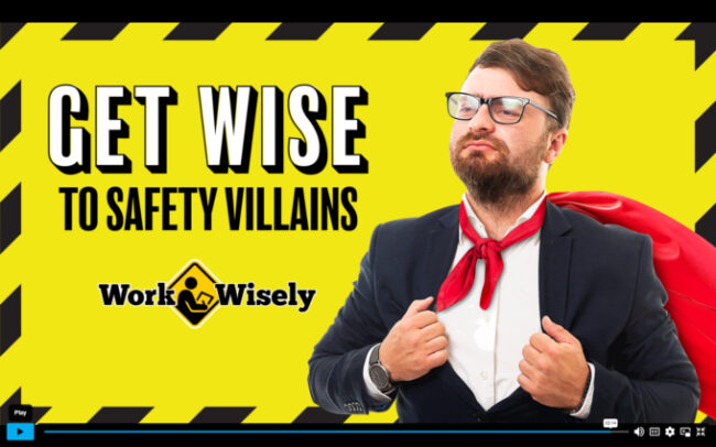 Screen shot from video Get Wise to Safety Villains shows title against safety yellow background and businessman with red cape blowing in breeze.