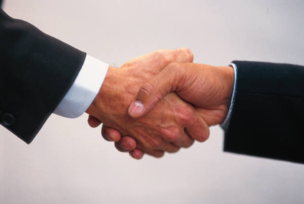 Close up of handshake between two business people