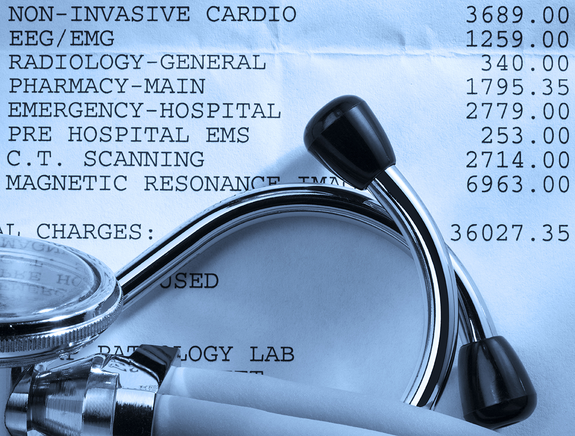 Close up of a stethoscope on top of a hospital bill with various charges.