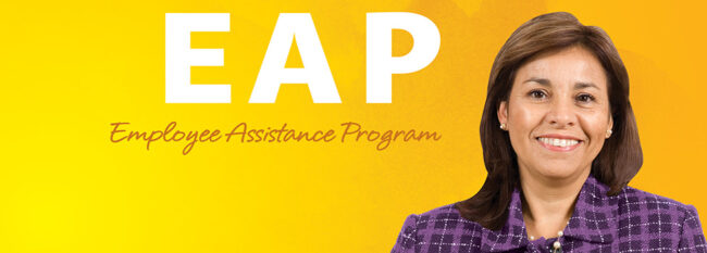 Smiling business woman against a mottled yellow background with white text to the left: EAP Employee Assistance Program