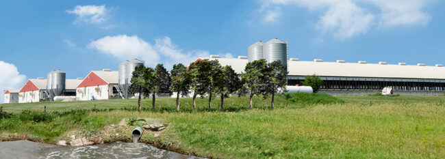 Farm with confinement buildings, barns, gran bins and runoff lagoon