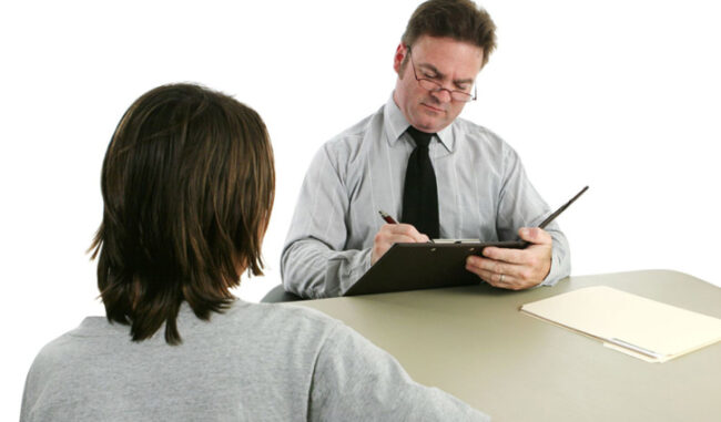 Supervisor meets with young worker