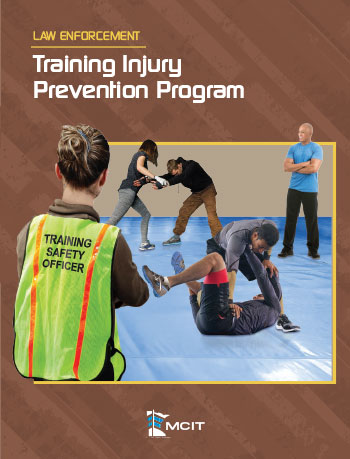 Law Enforcement Training Injury Prevention Program Cover. Woman wearing vest that says "Training Safety Officer". Watching de-escalation training.