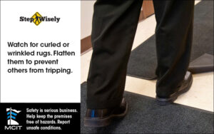 Step Wisely Email digital image. Watch for Curled Rugs. Man's foot getting caught under a curled rug.