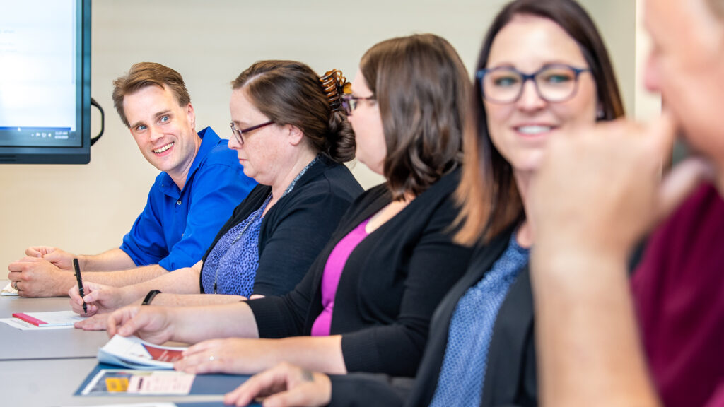 Staff collaborate during a meeting