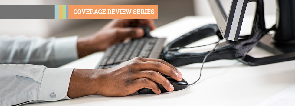 Coverage Review Series - man using computer - hands view only