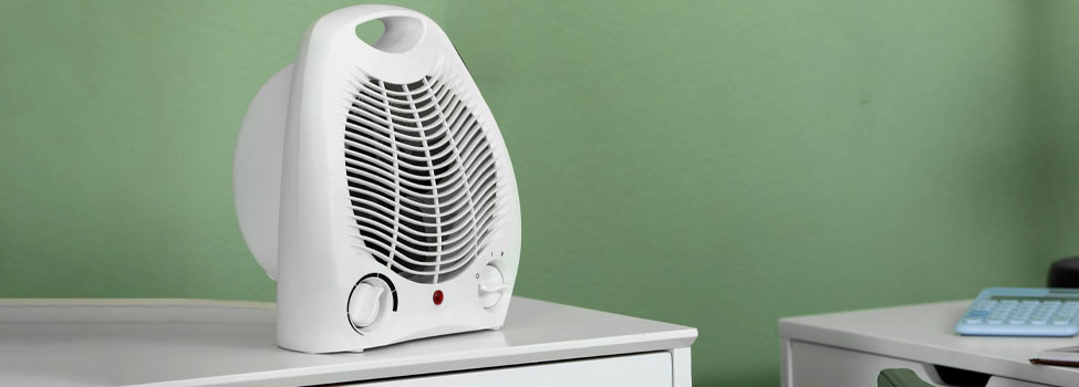 Space Heater on office desk drawers