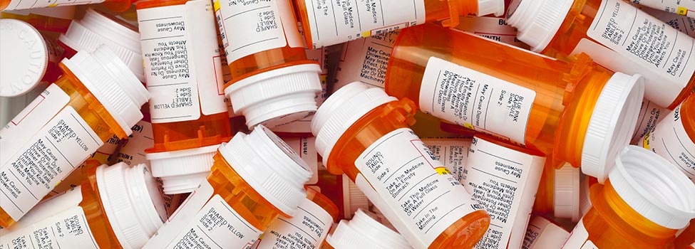 Pile of prescription pill bottles.