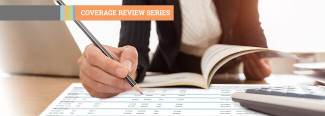 Coverage Review Series - Woman checking printed spreadsheet