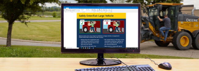 Ladder Safety email open on desktop computer. Man getting into large vehicle in the background.