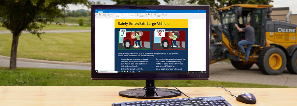 Ladder Safety email open on desktop computer. Man getting into large vehicle in the background.