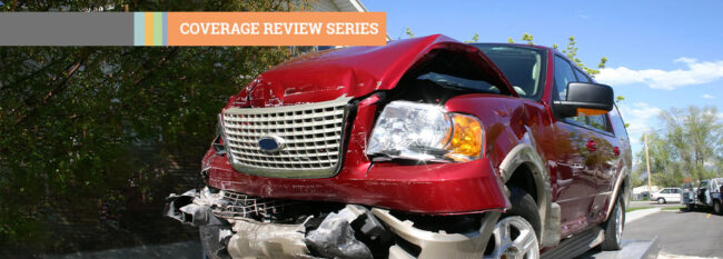 Coverage Review Series - Red totaled car being towed