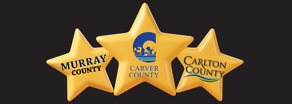 Logos for MCIT award winners Murray County, Carver County and Carlton County on gold stars against black background