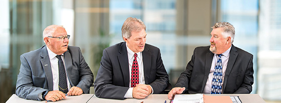 Don Wachal, Randy Schreifels and Ron Antony talk duirng MCIT board meeting